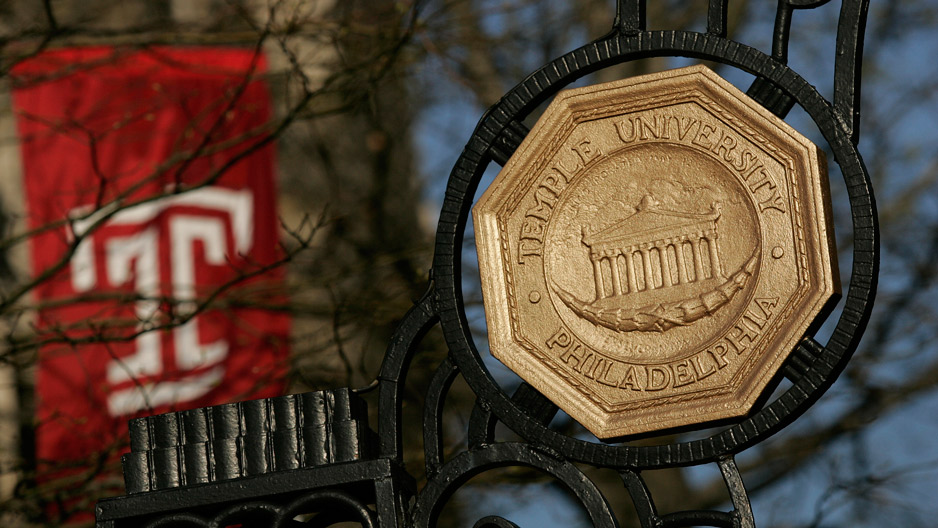 the iron gate leading onto Temple's Main Campus and a red Temple