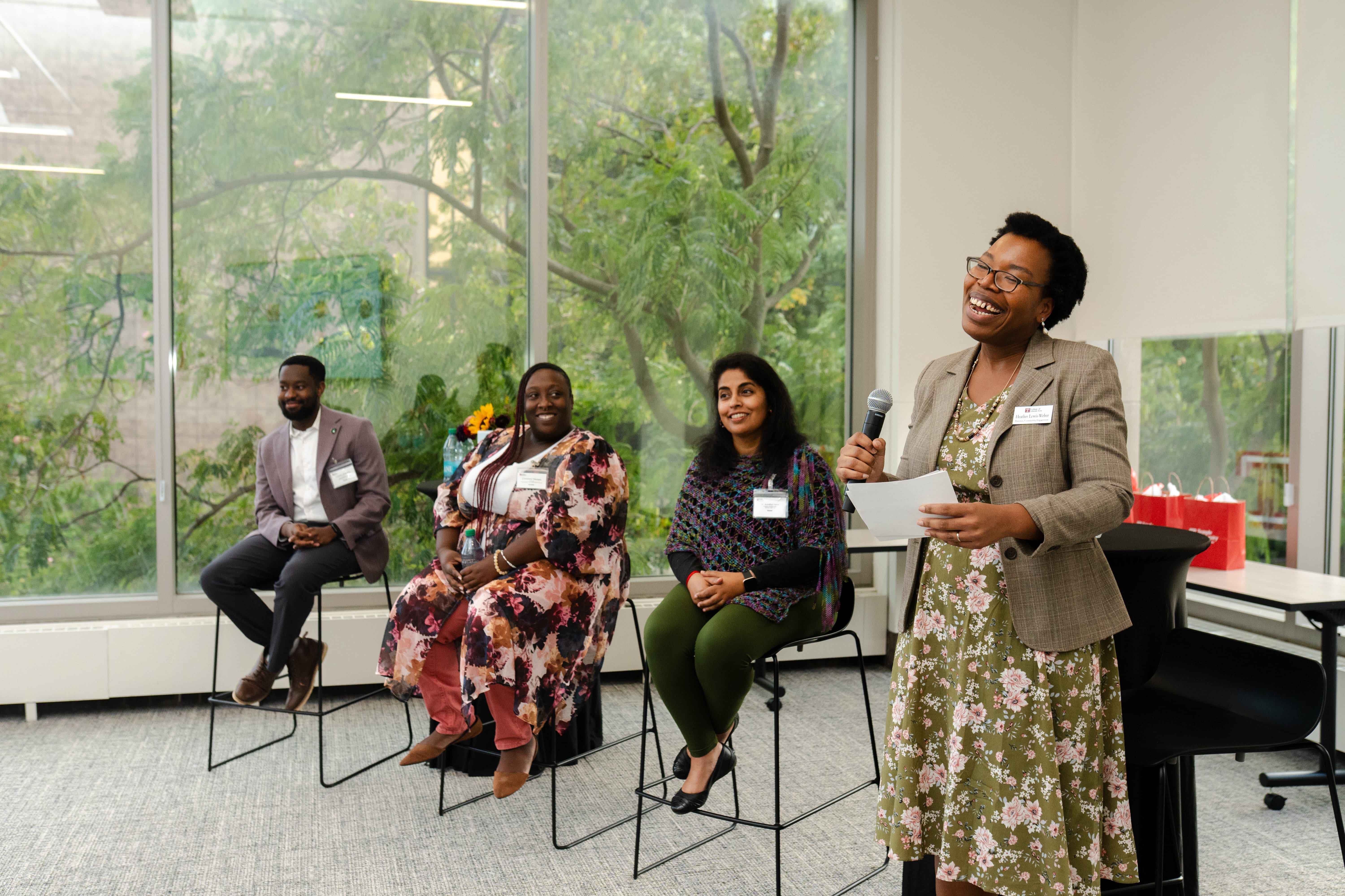 Heather Lewis-Weber and panelists at the opening event