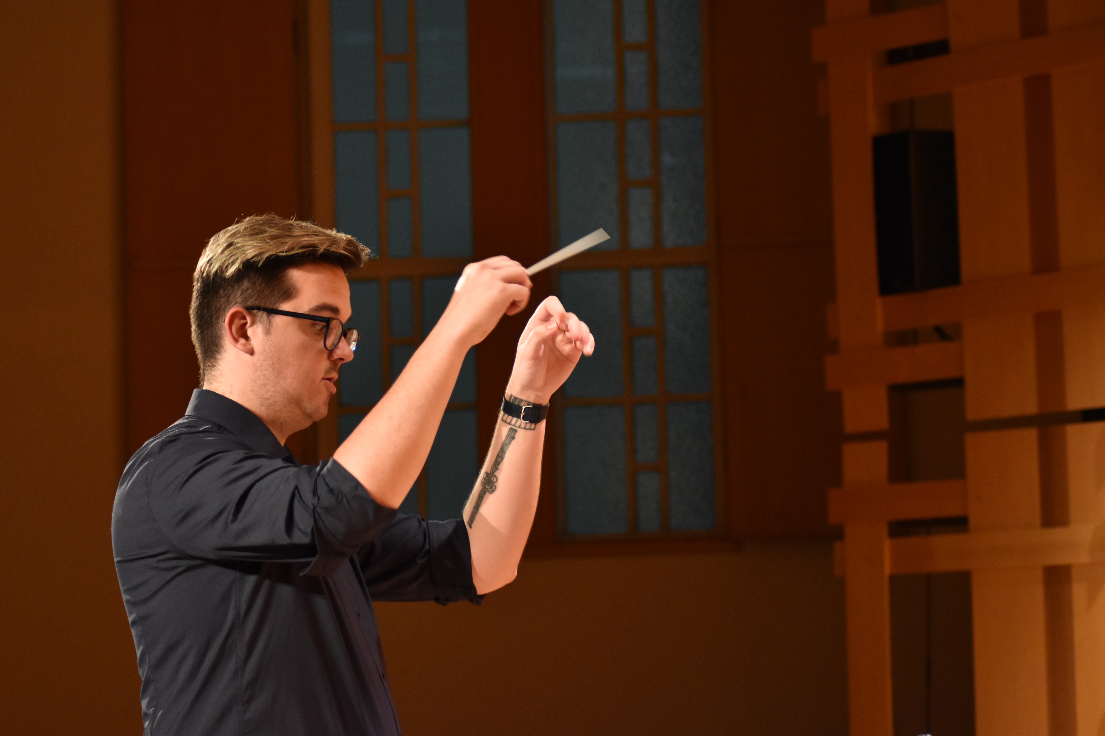 Image of Baker Purdon conducting a choir.