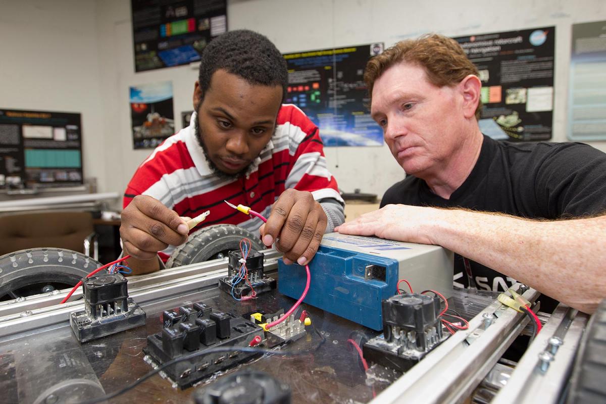 engineering student with teacher