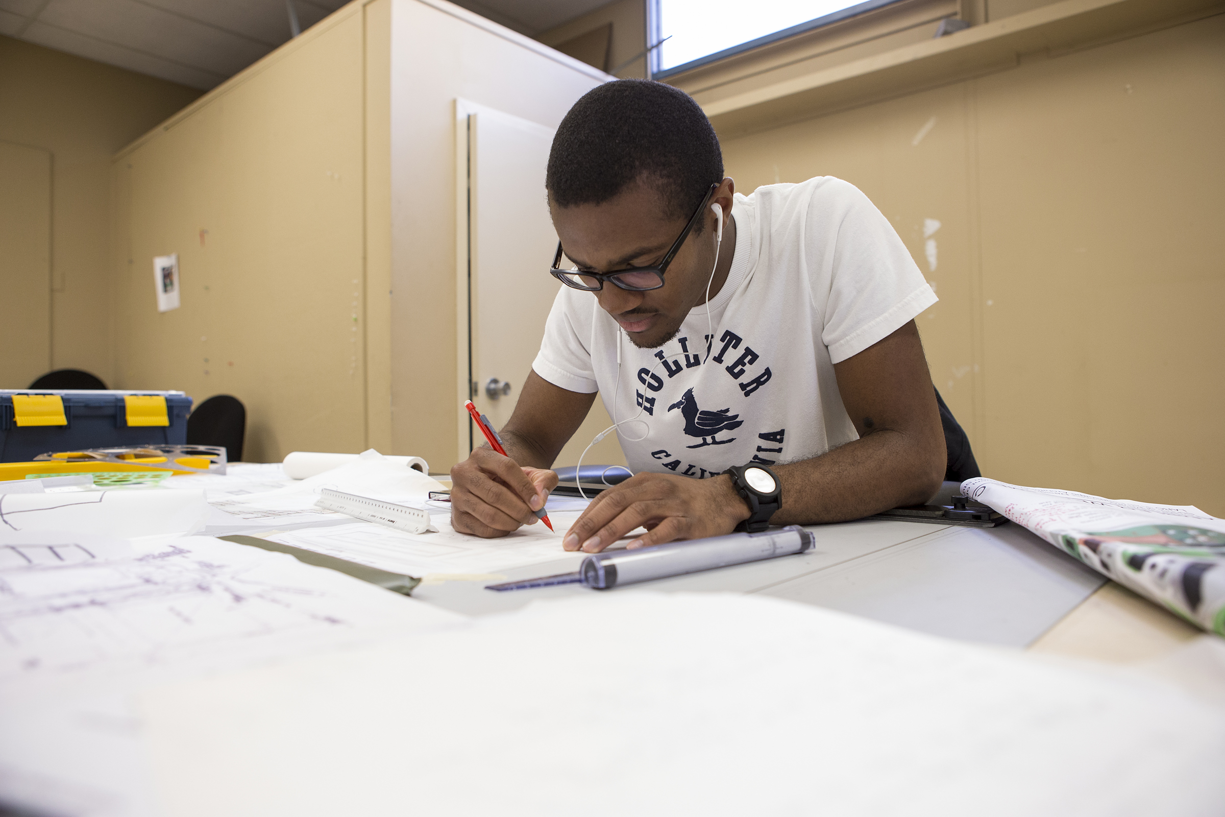 A landscape architecture student works on a design.