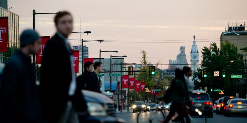 Pedestrians crossing Broad Street near Temple s Main Campus.