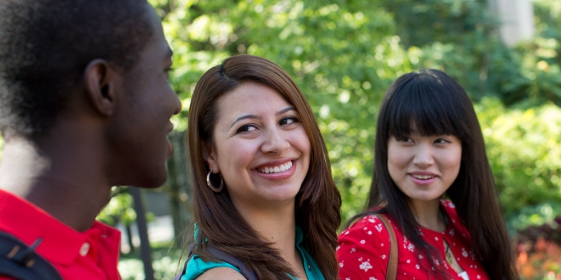 Three international students talking to each other on Temple s Main Campus.