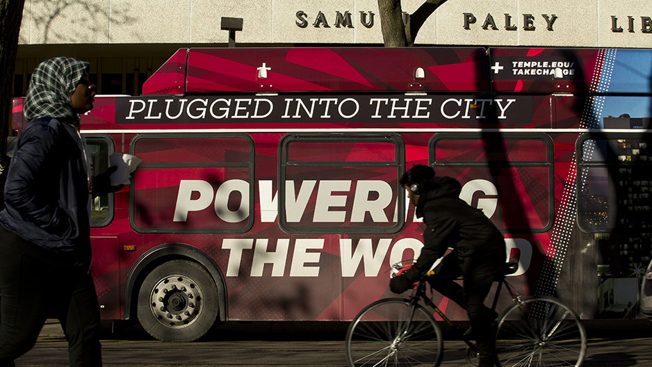 A Temple bus wrap that reads plugged into the city, powering the world outside of Paley library.