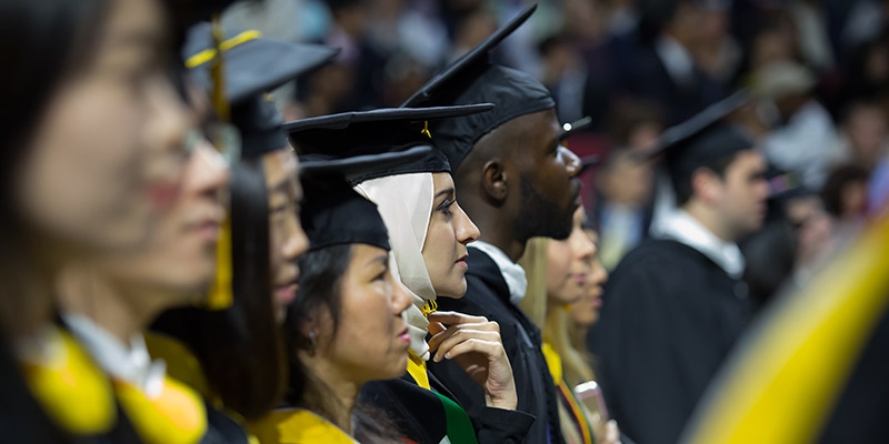 Members of Temple's Class of 2016 wearing Commencement caps and gowns.
