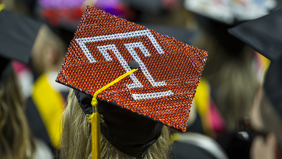 A cap bejeweled with a Temple T.