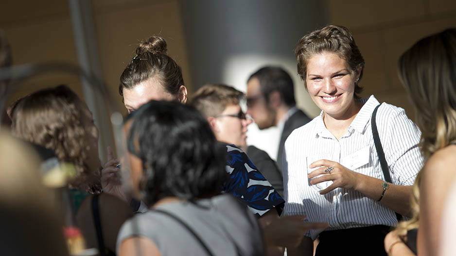 The Washington Center interns smiling and laughing at the reception.