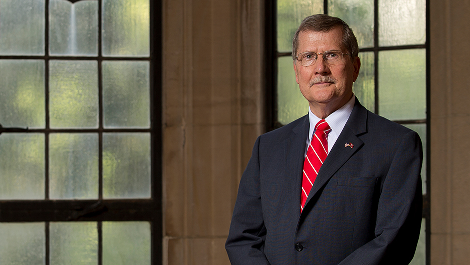 Richard M. Englert poses in a red tie