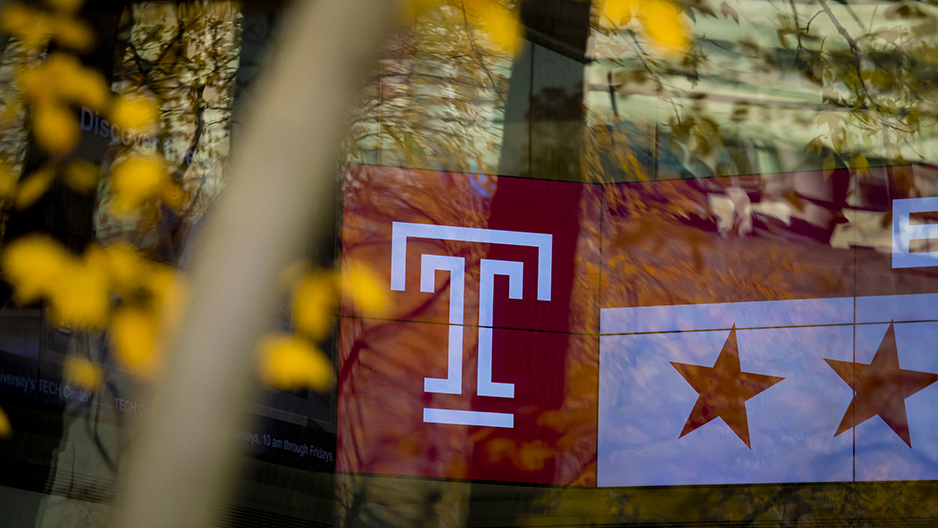 A Temple T with a tree in the foreground.