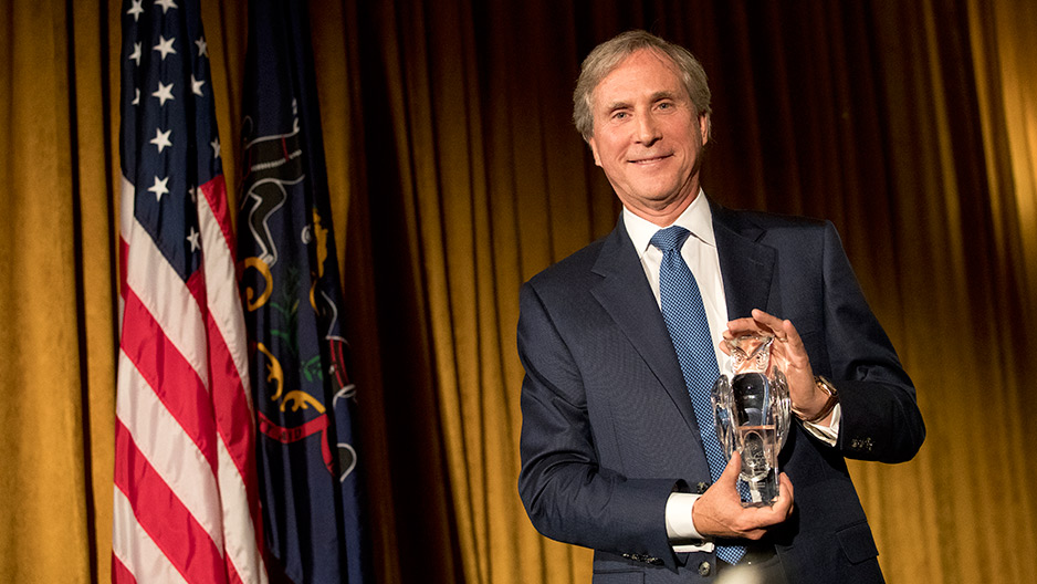 Musser Award recipient Gerard Sweeney holding his award.