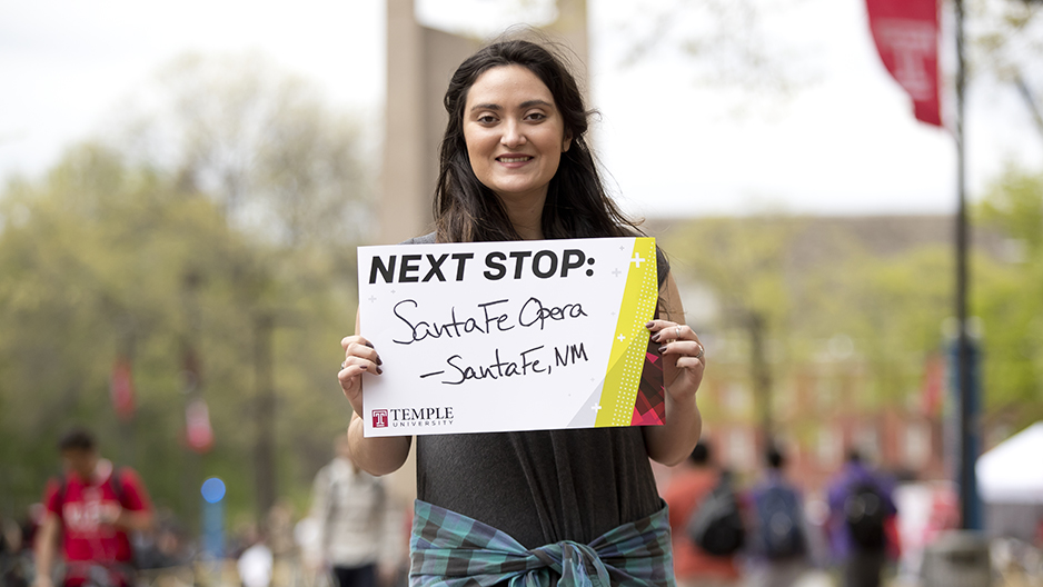 Courtney Banks holding a sign that says