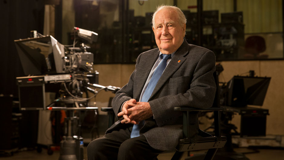 Lew Klein sitting in a TV studio