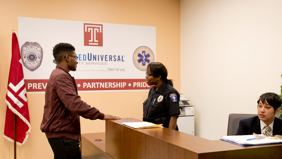 A man talking with a police officer inside the new station