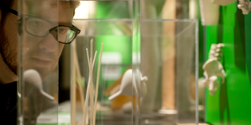 Man looking at 3-D printed needles in Franklin Institute exhibit