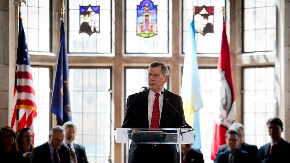 President Richard M. Englert speaking at a podium