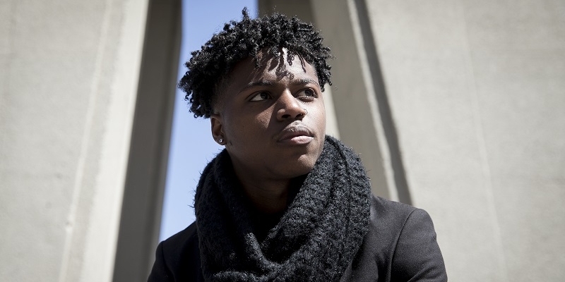 Jamal Parker standing near the Bell Tower.