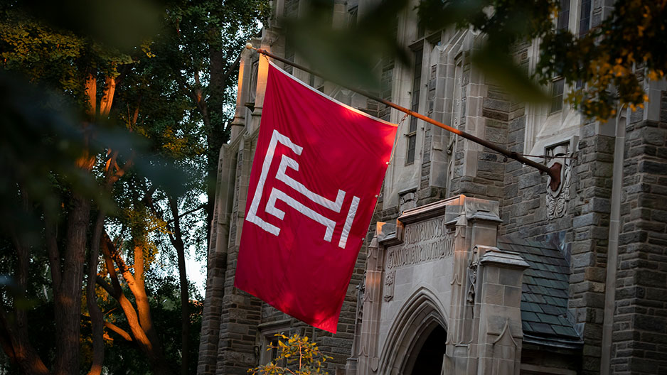 A red flag with a Temple