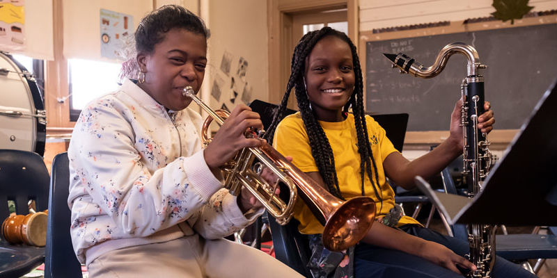 elementary school students playing instruments