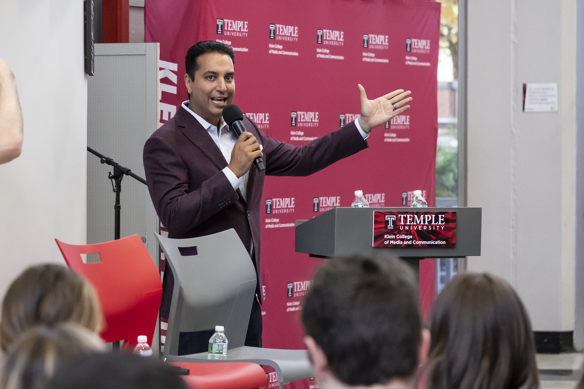 Image of Kevin Negandhi speaking at a summit event on Main Campus.