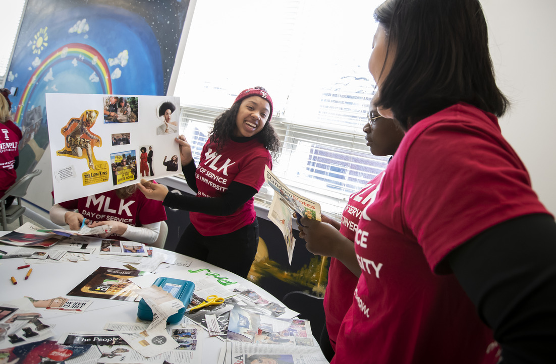 Image of women wearing cherry and white MLK Day shirts.
