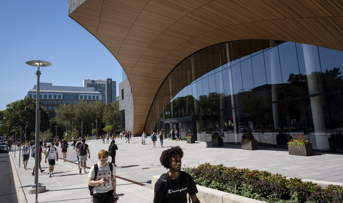 students walking in front of Charles Library