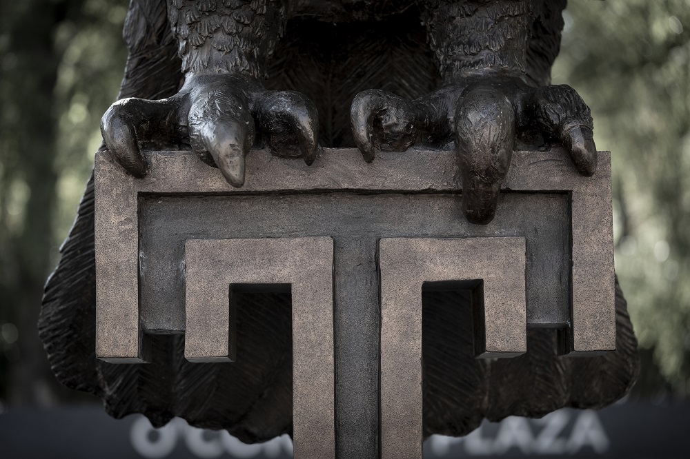 a close up of Main Campus' Owl statue's talons gripping the Temple