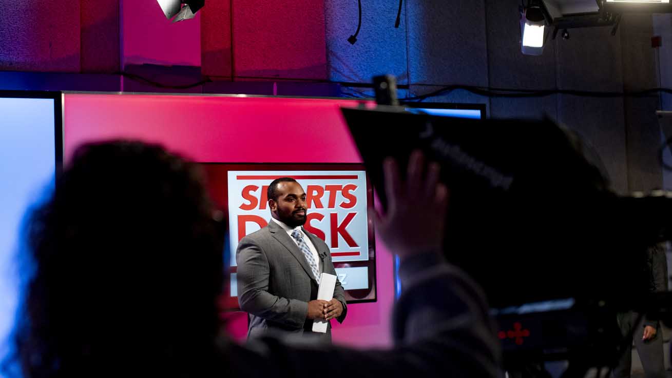 a student on the set of Sports Desk