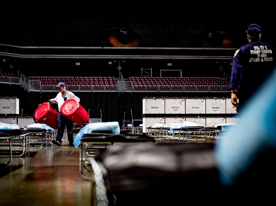 Emergency responders set up a field hospital in the Liacouras Center in March.