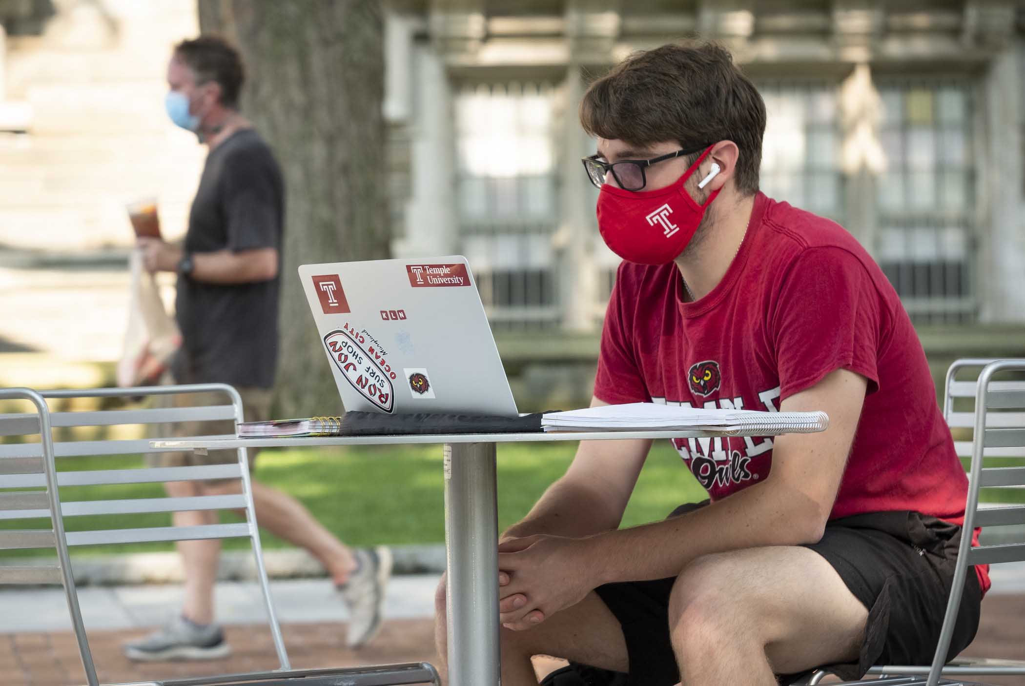 student with a lap top computer