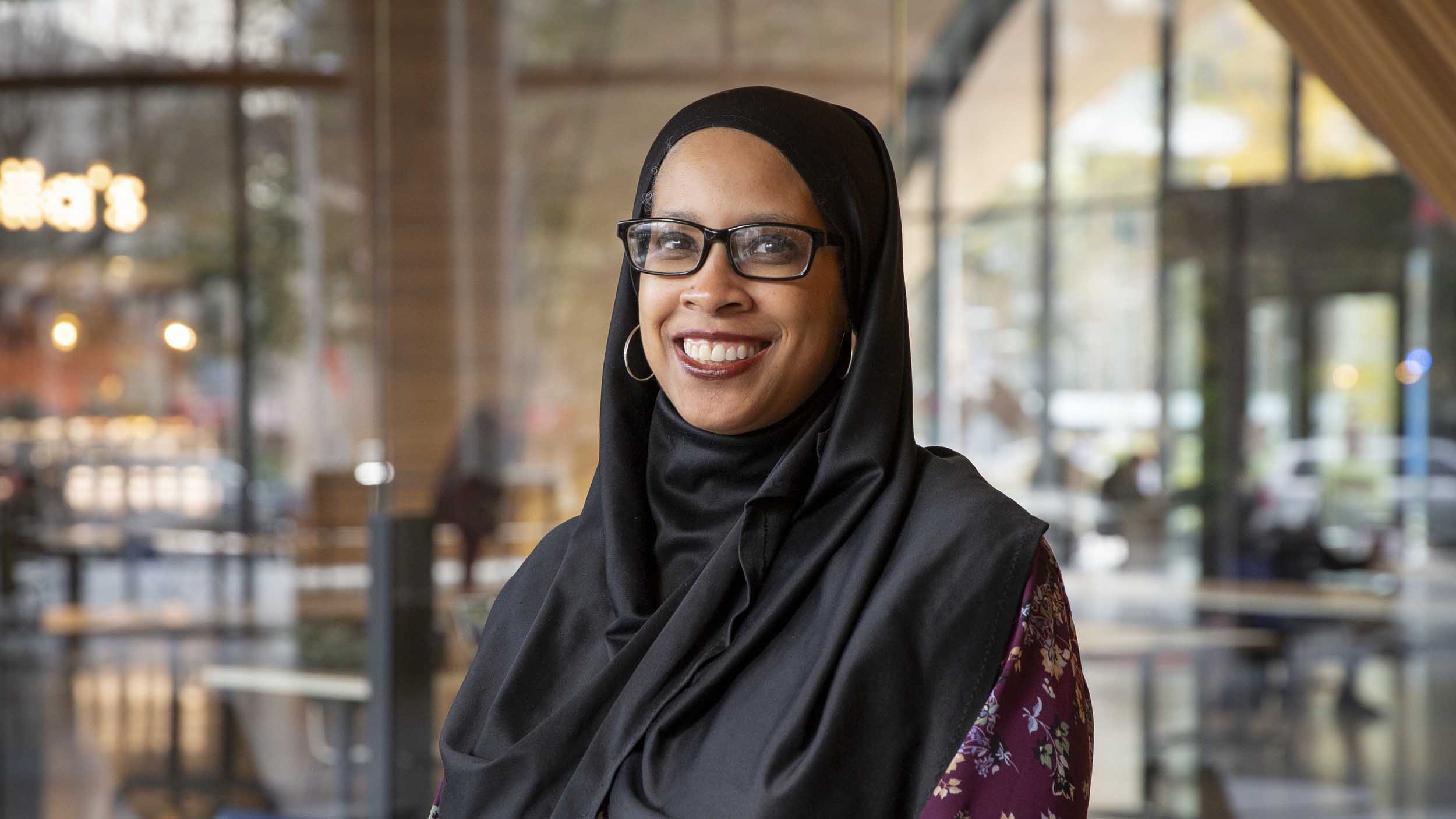 Tiffenia Archie smiling in the Student Center