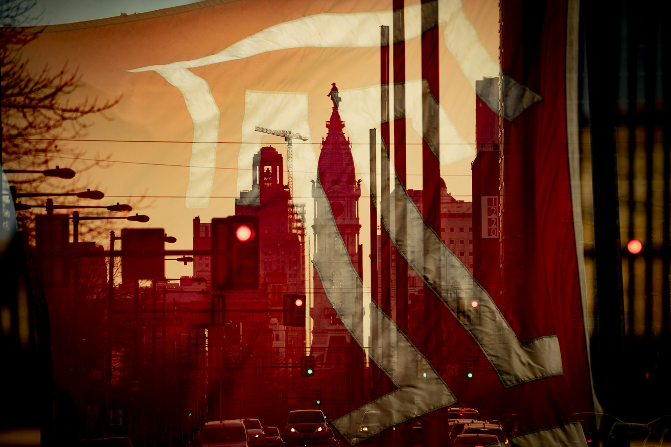 A Temple flag is seen superimposed over City Hall s William Penn statue.