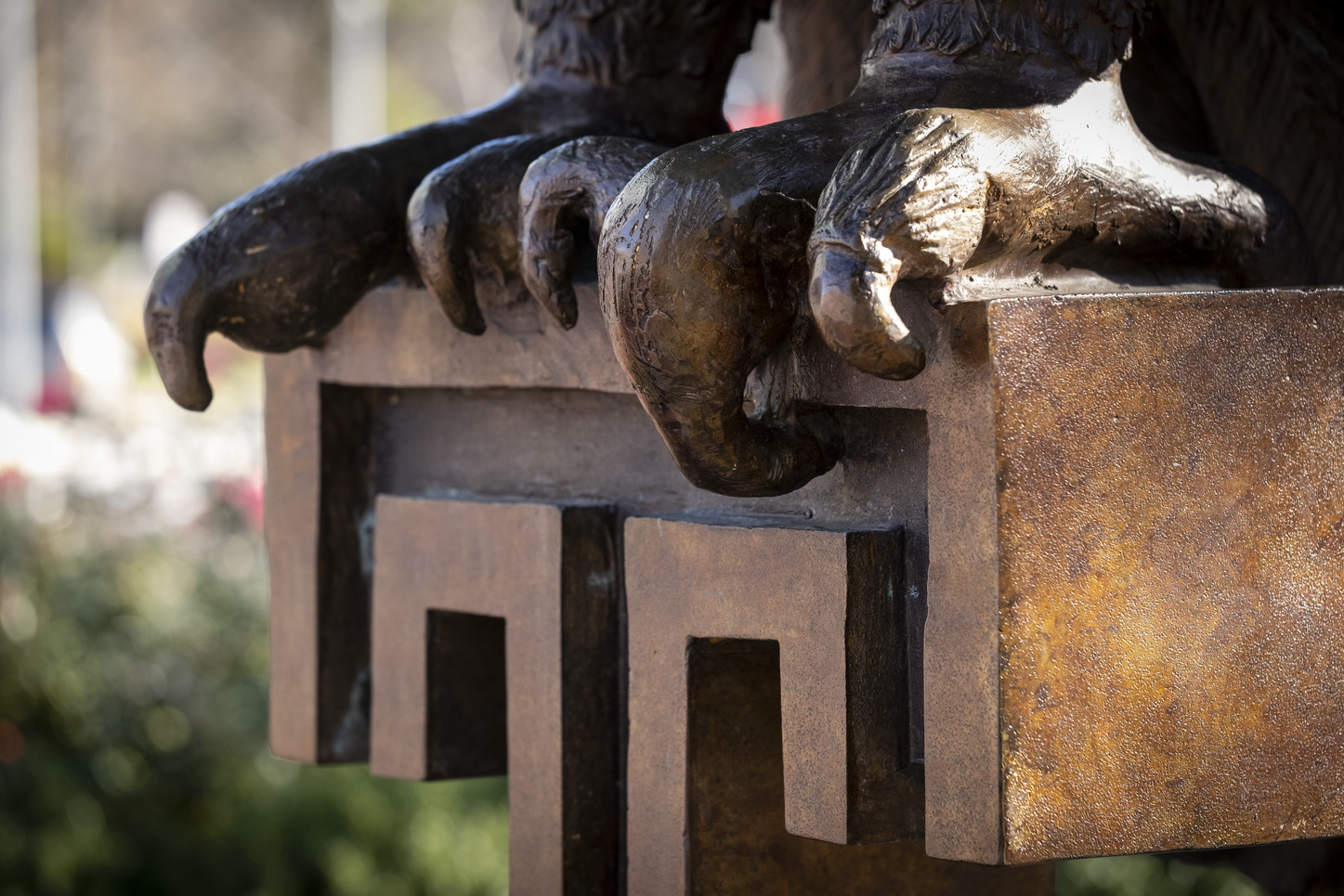 An Owl statue and the Temple T on Main Campus.
