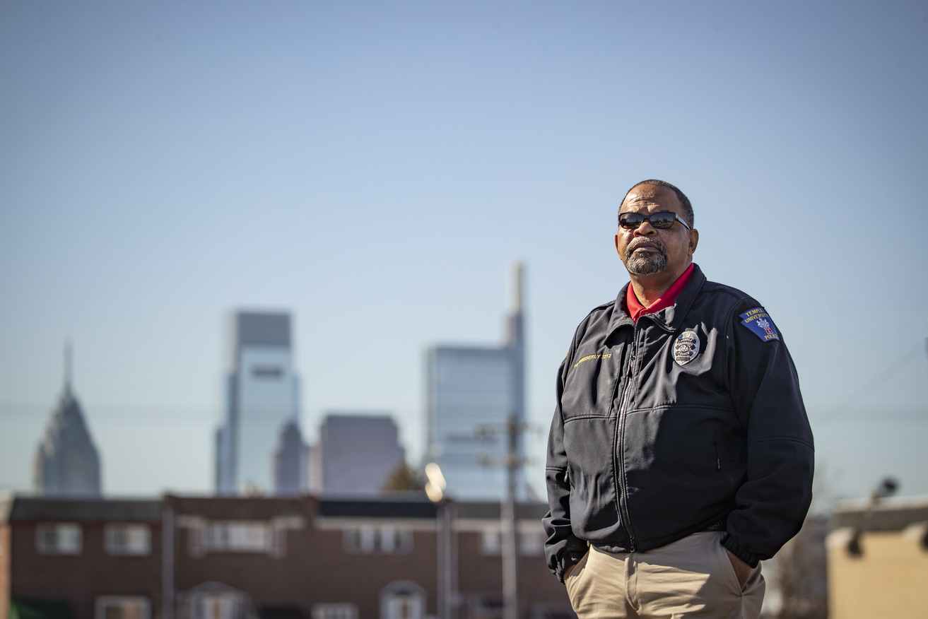 Image of a man in a Temple Police officer jacket outside in North Philadelphia.