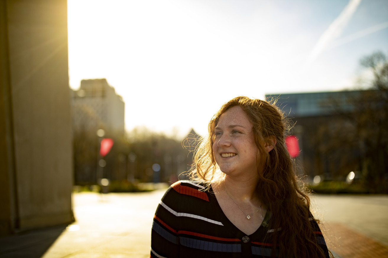 Natalie Ross standing before a sunset.