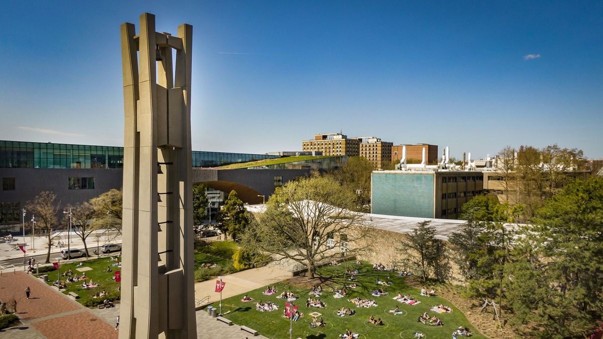 A Picture of the Bell Tower with students on beury beach