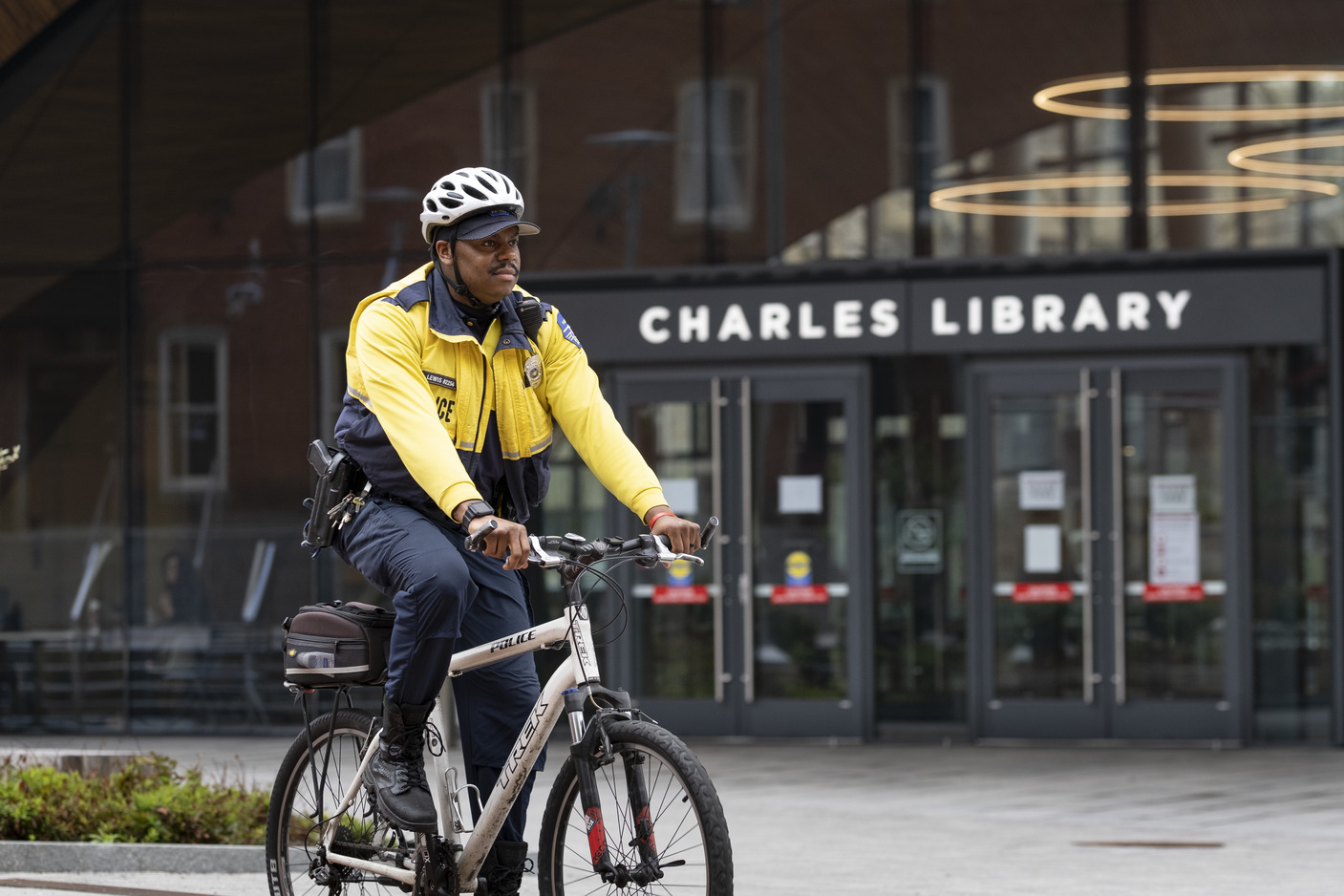 Officer Eliajah Lewis pictured on a bike outside Charles Library.