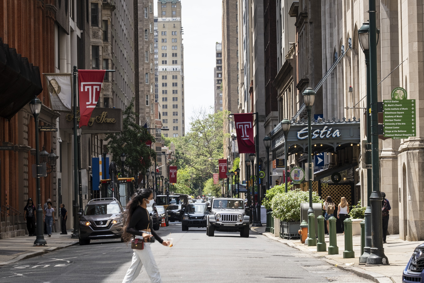 A young woman crosses the street in Center City.
