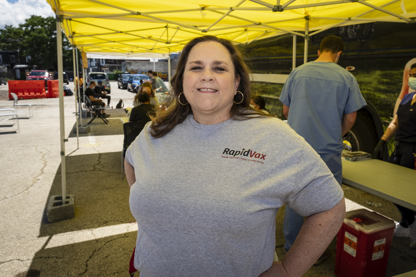 Sarah Bass helping at a neighborhood vaccine clinc