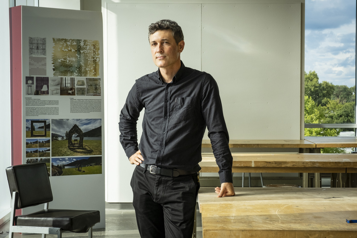 Gabriel Kaprielian wearing a black button down shirt and black pants