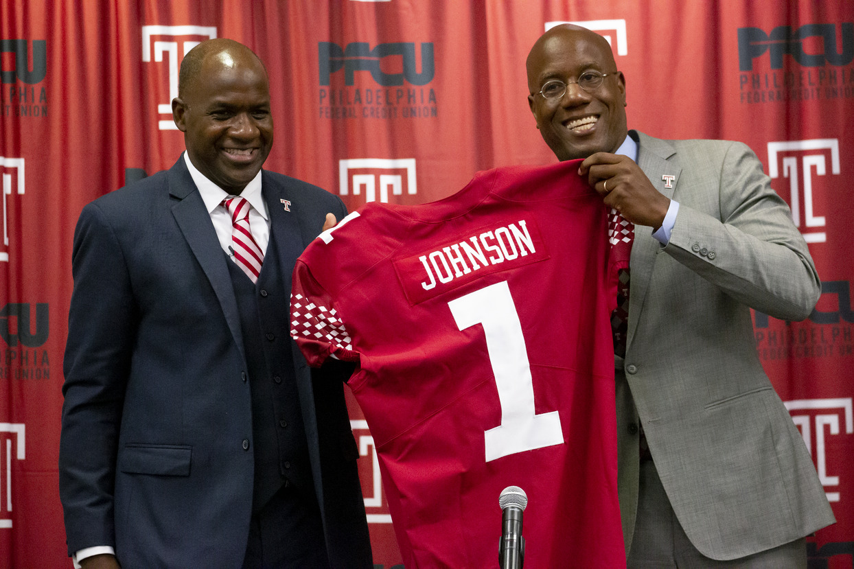Arthur Johnson pictured with President Wingard, holding Johnson's replica Temple jersey.