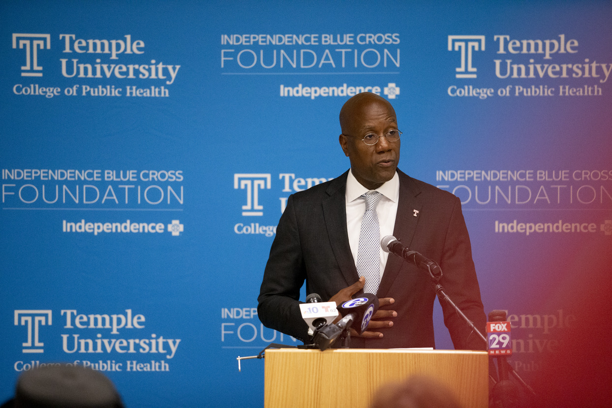 President Wingard in a black suit speaking at a podium