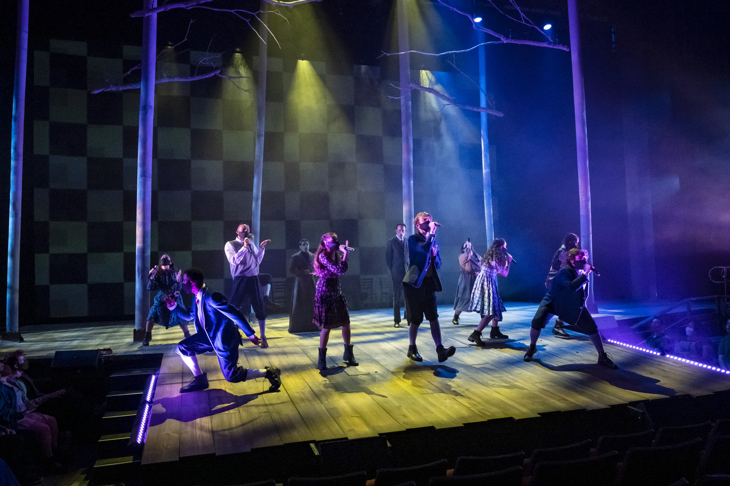 Students sing on stage during a performance of 'Spring Awakening.'