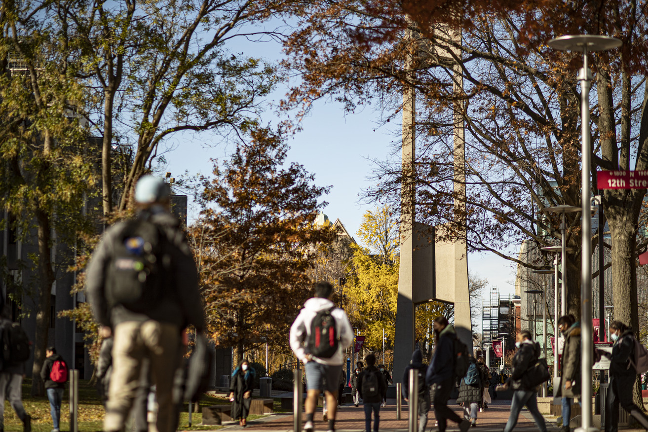 Image of students walking past the Bell Tower on Main Campus.