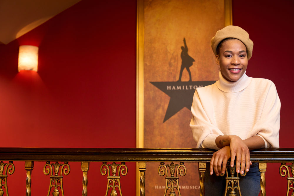 Paige Smallwood leaning against a railing