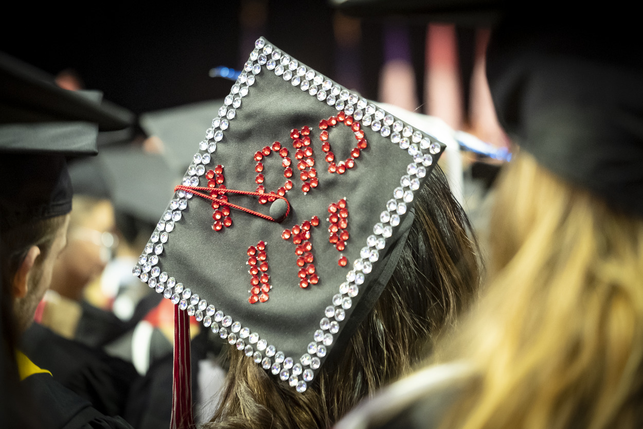 A student s graduation cap with I did it! written in rhinestones.