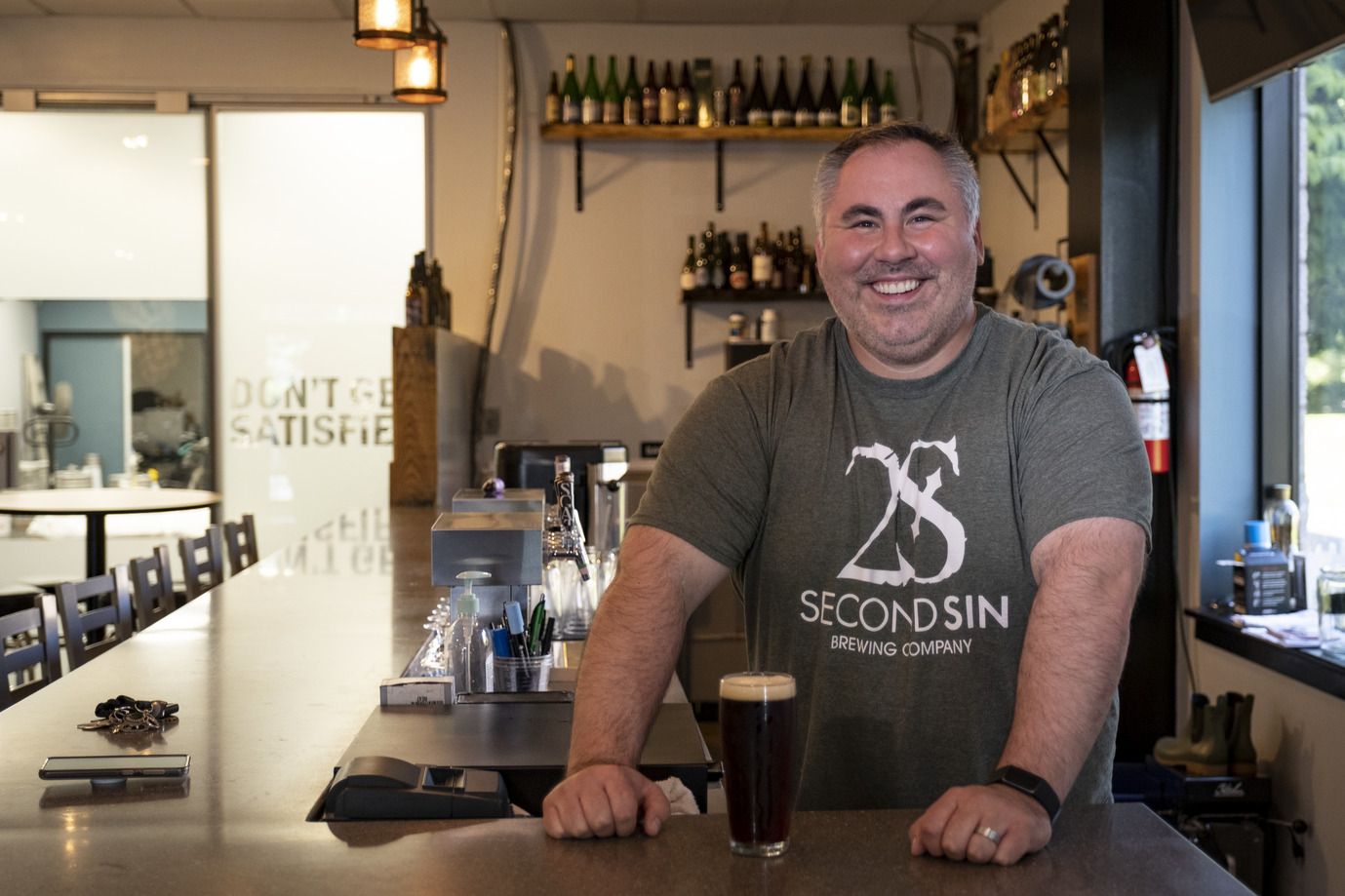 Mike Beresky pictured behind the Second Sin bar.