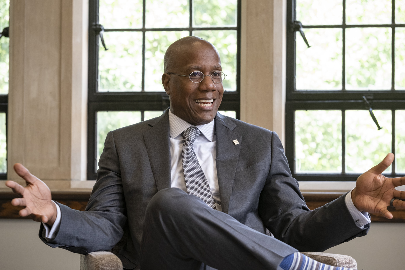 Image of President Wingard in an armchair, speaking.