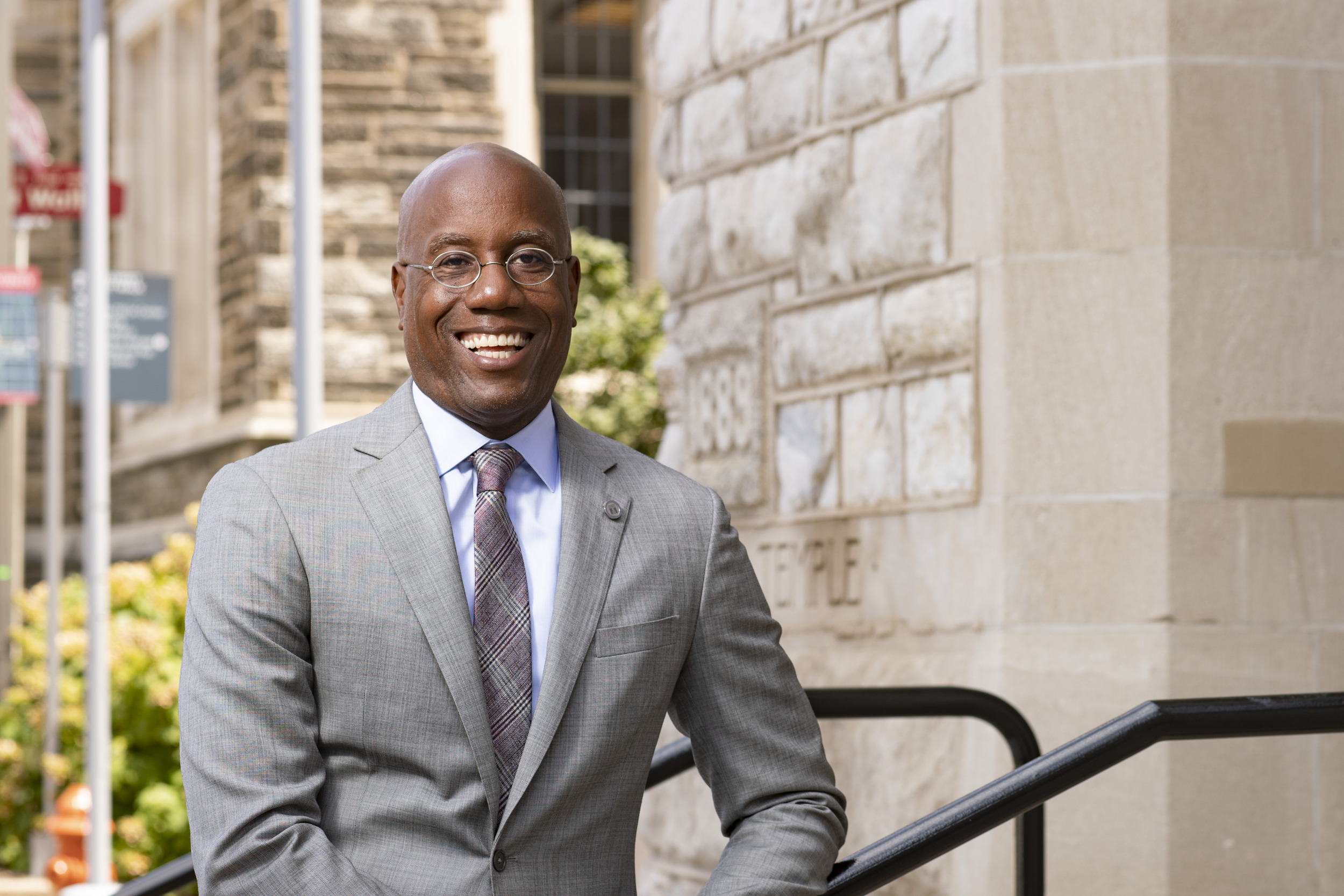 Temple President Jason Wingard posing outside.