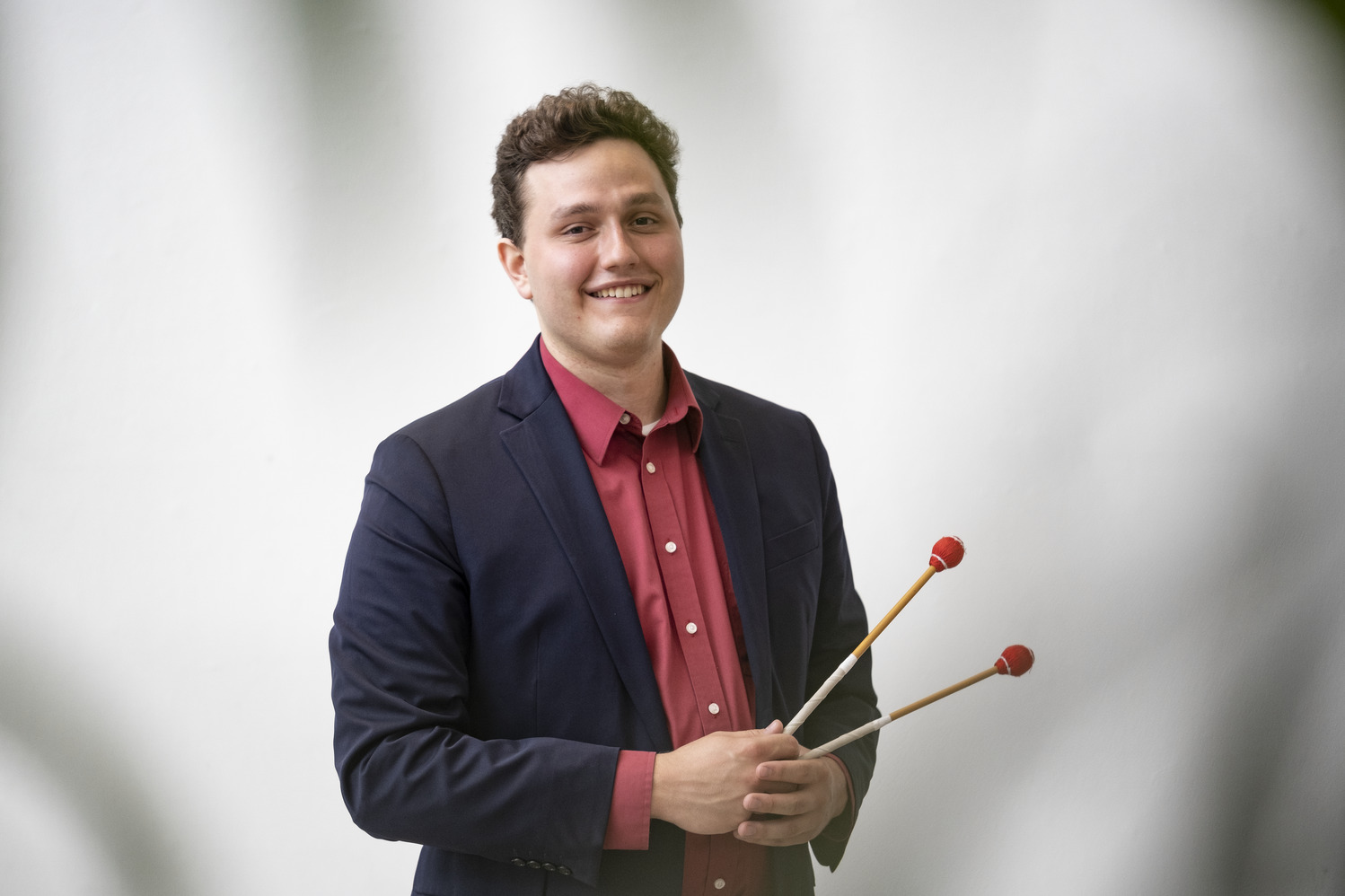 Caleb Breidenbaugh holding a xylophone hammer.