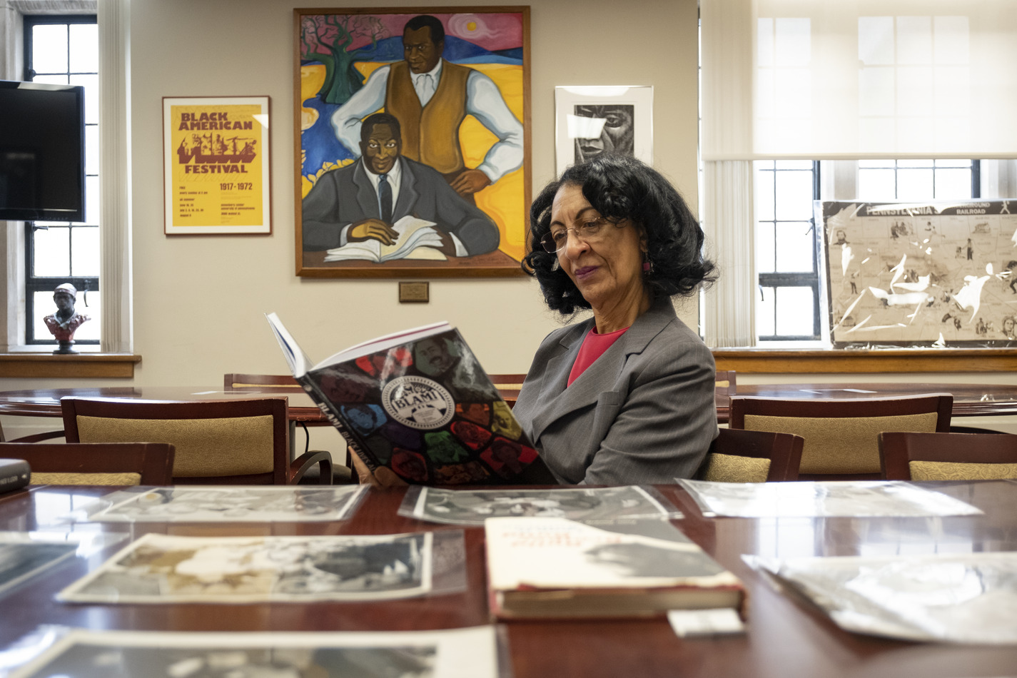 Diane Turner, curator of the Blockson Collection, reads a copy of the collection s new graphic novel, Black Lives Always Mattered!